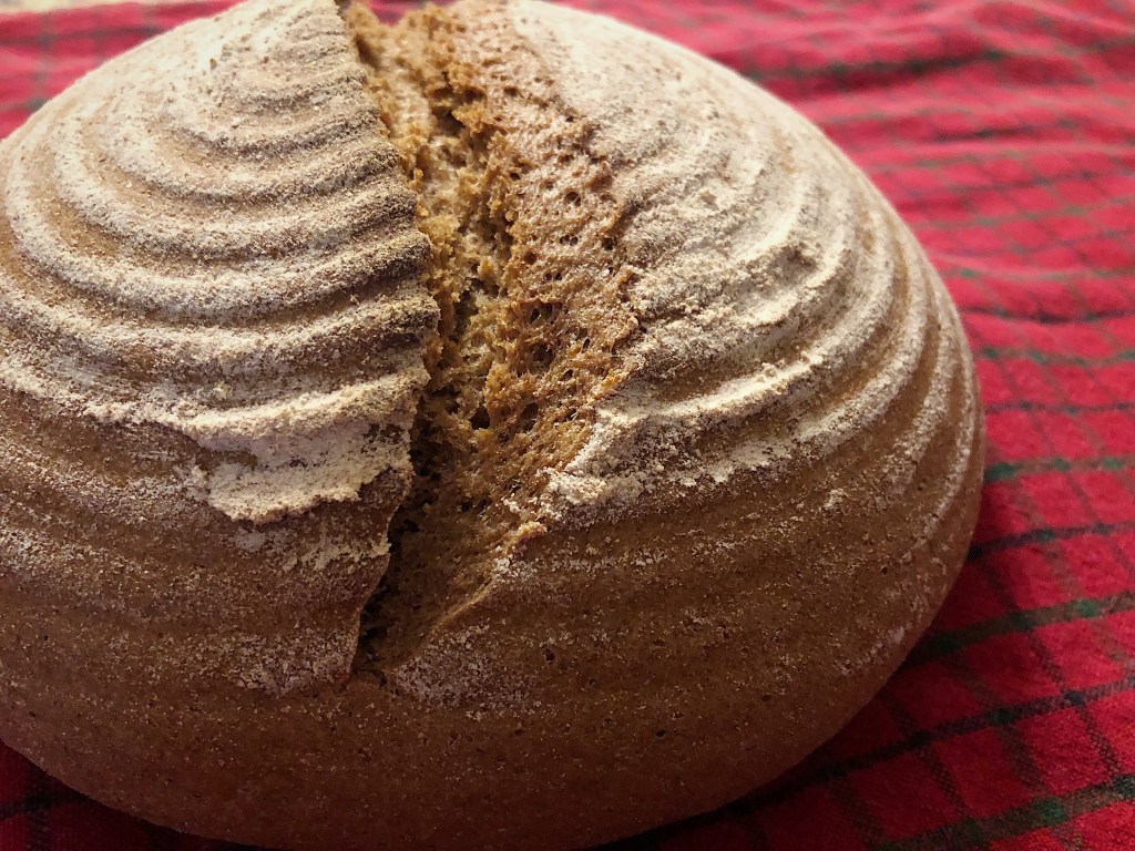 A rustic loaf of rye and wheat bread